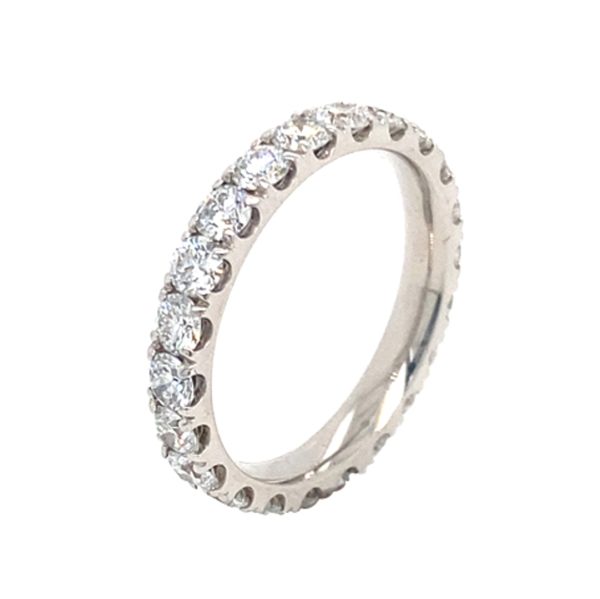 Before enhancement: diamond ring photographed with dull lighting and a dark, distracting background.